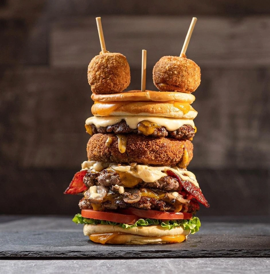 A stacked Bullger burger with crispy toppings